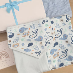 A blue cellular baby blanket , baby vest with a playful underwater animal print in blue, baby bib, mittens and a gift box with a light blue ribbon.