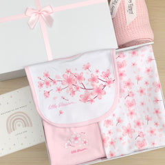 New baby gift baby girls pink and white blossom floral baby grow, vest, hat, mittens, pretty blossom floral bib, wooden heart plaque welcome to the world and a soft pink cellular baby blanket.