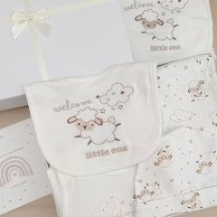 New baby gift little lamb design Cream and beige baby blanket baby wrap trousers baby vest baby hat. Gift wrapped in luxury white tissue paper and a white box with cream ribbon.