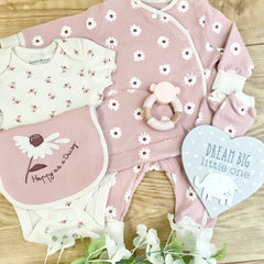 New baby girl Gift 7 piece gift set pink with white daisy design  contains sleepsuit vest hat mittens bib wooden heart plaque  and a silicone wooden teether