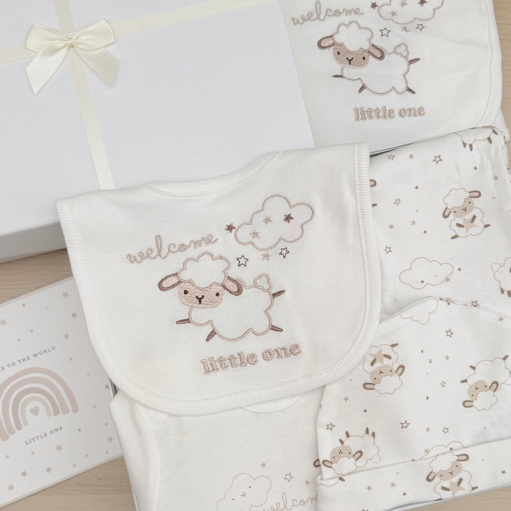 New baby gift little lamb design Cream and beige baby blanket baby wrap trousers baby vest baby hat. Gift wrapped in luxury white tissue paper and a white box with cream ribbon.
